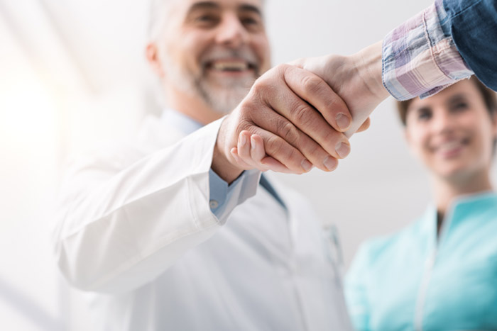 Doctor Shaking Hands with Patient